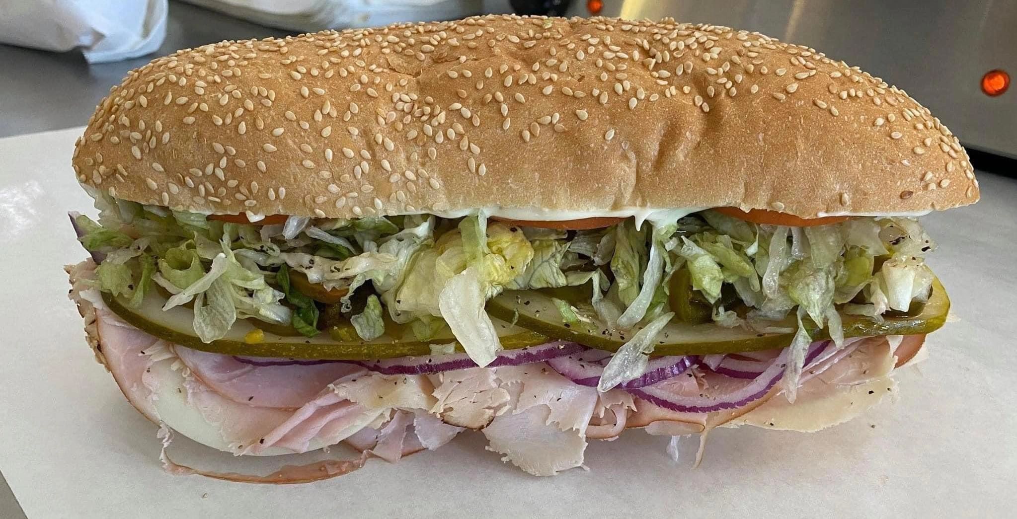 A full Dino's sub on fresh sesame bread